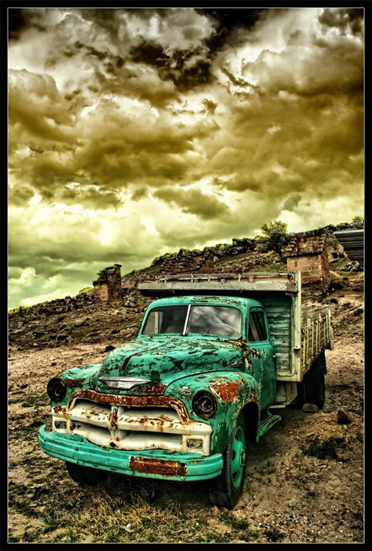 HDR photo for old truck in a farm the rust on the car just merged with 
